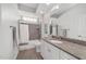 Well-lit bathroom with tiled shower, granite counters, and a large mirror at 1910 Se 28Th Pl, Ocala, FL 34471