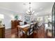 Elegant living and dining area with hardwood floors and ample natural light at 1910 Se 28Th Pl, Ocala, FL 34471