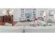 Cozy living room featuring built-in shelves, comfortable seating, and a stylish rug at 1910 Se 28Th Pl, Ocala, FL 34471