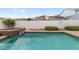 Backyard pool area with hot tub, privacy fence, well maintained landscaping, and pink flamingo at 1910 Se 28Th Pl, Ocala, FL 34471