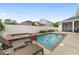 Backyard pool area featuring hot tub, lounge chairs, patio area, and well maintained landscaping at 1910 Se 28Th Pl, Ocala, FL 34471