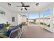 Screened-in patio with comfortable seating, offering a view of the backyard pool at 1910 Se 28Th Pl, Ocala, FL 34471