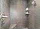 Modern shower featuring gray tile, built-in shelves, a bench, and brushed nickel hardware at 1910 Se 28Th Pl, Ocala, FL 34471