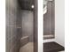 Elegant walk-in shower with dark tiles and built-in seating at 1910 Se 28Th Pl, Ocala, FL 34471