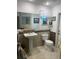 Cozy bathroom featuring pedestal sink, toilet, and decorative accents at 19903 Sw 97Th Ln, Dunnellon, FL 34432