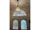 Arched window and lighting fixture at the front entry at 19903 Sw 97Th Ln, Dunnellon, FL 34432