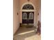 Inviting front entry with a decorative double-door and unique accents at 19903 Sw 97Th Ln, Dunnellon, FL 34432