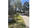 Street view of a lush green yard with mature trees at 19903 Sw 97Th Ln, Dunnellon, FL 34432