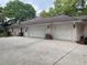 Spacious three car garage and long driveway at 19903 Sw 97Th Ln, Dunnellon, FL 34432