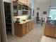 Open-concept kitchen with granite counters, ample cabinetry, and modern lighting at 19903 Sw 97Th Ln, Dunnellon, FL 34432