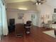 Comfortable living room with hardwood floors and ample seating at 19903 Sw 97Th Ln, Dunnellon, FL 34432