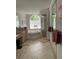 Bright main bathroom with soaking tub, vanity, and glass block window at 19903 Sw 97Th Ln, Dunnellon, FL 34432