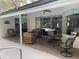 Relaxing lanai with outdoor seating overlooking a beautiful pool, perfect for entertaining guests at 19903 Sw 97Th Ln, Dunnellon, FL 34432