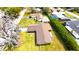 This aerial view showcases the home's backyard, roof, and surrounding neighborhood with swimming pools at 2146 Ne 10Th St, Ocala, FL 34470