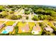 Neighborhood aerial view showcasing the home's location amongst mature trees, neighboring houses and streets at 2146 Ne 10Th St, Ocala, FL 34470