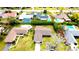 An aerial view showcases the house and neighboring properties, highlighting nearby swimming pools at 2146 Ne 10Th St, Ocala, FL 34470