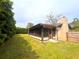 Large backyard features a screened in porch with mature hedges at 2146 Ne 10Th St, Ocala, FL 34470
