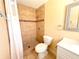 Bathroom showcasing a tiled shower, toilet, and vanity with modern finishes at 2146 Ne 10Th St, Ocala, FL 34470