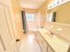 Bright bathroom featuring a shower-tub combination and a single sink vanity at 2146 Ne 10Th St, Ocala, FL 34470