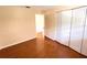 Bedroom with hardwood floors and a closet with bi-fold doors at 2146 Ne 10Th St, Ocala, FL 34470