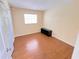 Bedroom featuring hardwood floors, a window, and a closet at 2146 Ne 10Th St, Ocala, FL 34470