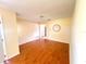 Dining room with hardwood floors, yellow walls, and minimalist decor at 2146 Ne 10Th St, Ocala, FL 34470