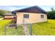 Side of the home with newer vinyl siding and a chain link fence in the yard at 2146 Ne 10Th St, Ocala, FL 34470