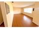 Living room featuring wood floors, a window, and wall decor at 2146 Ne 10Th St, Ocala, FL 34470