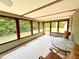 Enclosed sunroom with many windows providing natural light and backyard views at 2146 Ne 10Th St, Ocala, FL 34470