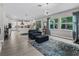 Expansive living area featuring tile floors, neutral tones, comfortable seating and abundant natural light at 3920 Se 7Th Ave, Ocala, FL 34480