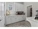 Convenient pantry area with white cabinetry, countertop space, and storage for kitchen appliances at 3920 Se 7Th Ave, Ocala, FL 34480