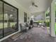 Covered brick patio with seating and grilling area at 3920 Se 7Th Ave, Ocala, FL 34480