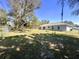 Spacious backyard with a chain-link fence, perfect for outdoor activities at 416 Marion Oaks Crse, Ocala, FL 34473