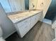 Bathroom featuring a large mirror over vanity, sink and drawers, and tiled walk-in shower at 416 Marion Oaks Crse, Ocala, FL 34473