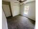 Carpeted bedroom featuring a ceiling fan, closet and a window offering natural light at 416 Marion Oaks Crse, Ocala, FL 34473