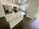 Kitchen features stainless appliances, white cabinets, and center island at 416 Marion Oaks Crse, Ocala, FL 34473