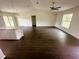 View of the living room featuring wood floors and a view to the backyard at 416 Marion Oaks Crse, Ocala, FL 34473