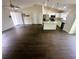Bright open floor plan with wood floors connects living room to the kitchen at 416 Marion Oaks Crse, Ocala, FL 34473