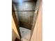 Modern shower features gray tile walls, white tile floor and updated shower head and hardware at 416 Marion Oaks Crse, Ocala, FL 34473