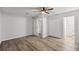 Bedroom features wood-look floors, neutral walls, and ample closet space for storage at 4516 Ne 8Th St, Ocala, FL 34470