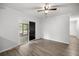 Bright bedroom with sliding glass doors leading to a pool area and wood-look floors at 4516 Ne 8Th St, Ocala, FL 34470