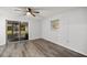 Bedroom featuring wood-look floors and sliding glass doors with a backyard view at 4516 Ne 8Th St, Ocala, FL 34470