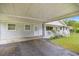 Attached carport showing the side entry and porch of the residence at 4516 Ne 8Th St, Ocala, FL 34470