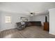 Spacious living room with modern flooring, ample seating, and a bright window at 4516 Ne 8Th St, Ocala, FL 34470