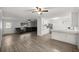 Expansive living room seamlessly connects to the kitchen, featuring sleek floors and an open layout at 4516 Ne 8Th St, Ocala, FL 34470