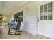 Inviting front porch with comfortable rocking chairs, perfect for relaxing outdoors at 4516 Ne 8Th St, Ocala, FL 34470
