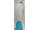 Shower stall features white tiled walls and flooring with modern shower head at 4516 Ne 8Th St, Ocala, FL 34470