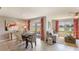 Bright living room featuring a dining area, comfortable seating, and a view of the water at 4738 Sw 88Th Ln, Ocala, FL 34476