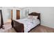 Comfortable bedroom featuring a large bed, carpet, window and a closet at 501 Fairways Ln # A, Ocala, FL 34472