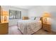 Cozy bedroom with a large window, comfortable bed, side tables and lamps for a relaxing atmosphere at 501 Fairways Ln # A, Ocala, FL 34472
